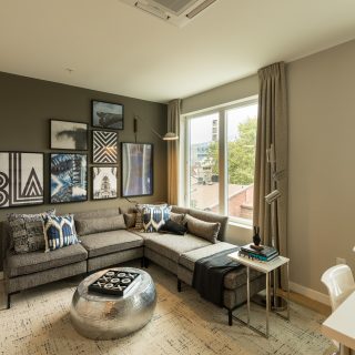 Open concept living room with hardwood floors and wonderful view of city in Old City apartment rentals